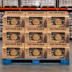 Age Your Own whiskey kits stacked on pallet for bulk retail display in warehouse store