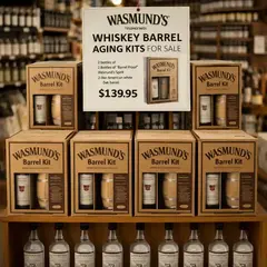 Wasmund’s whiskey barrel aging kits retail display with single malt spirit bottles on shelf