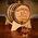 Custom engraved oak whiskey aging barrel pouring whiskey into glass on wooden table